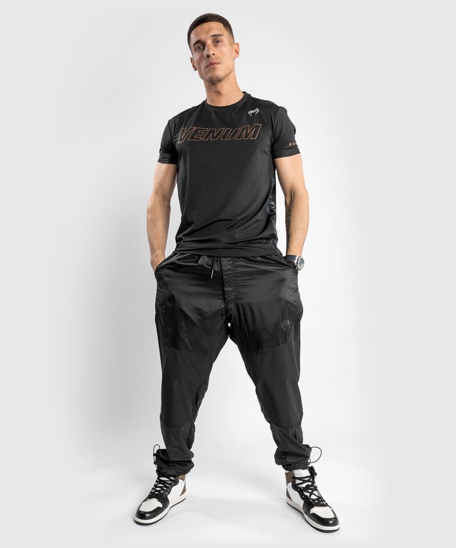 camiseta venum classic evo dry tech - pretabronze