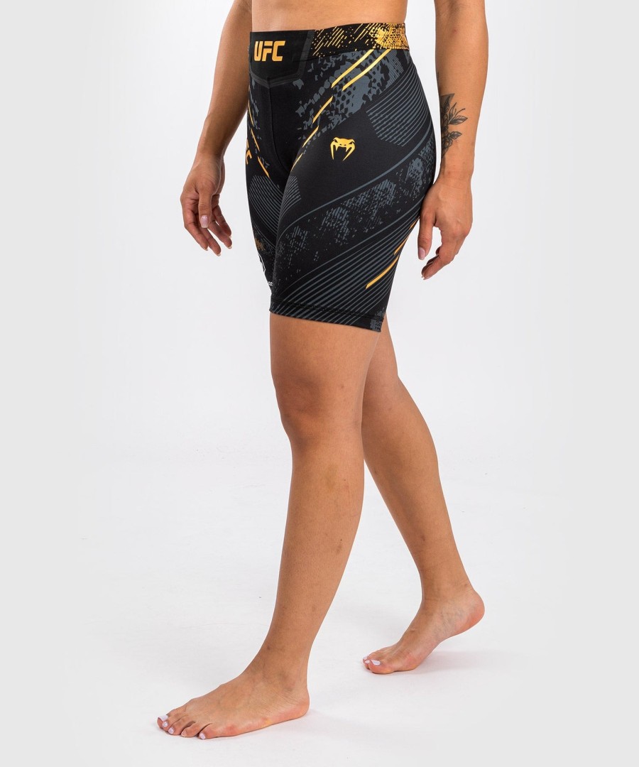 ufc adrenaline by venum authentic fight night feminino vale tudo short - long fit - campeão