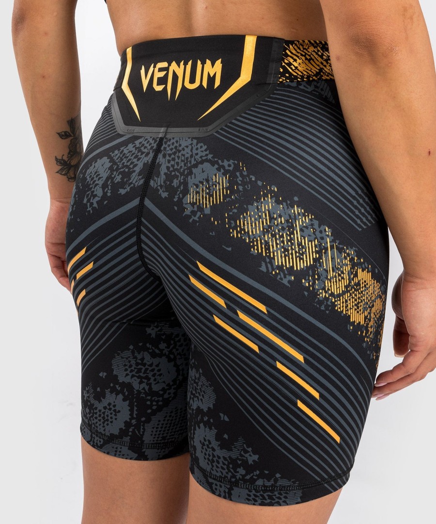 ufc adrenaline by venum authentic fight night feminino vale tudo short - long fit - campeão