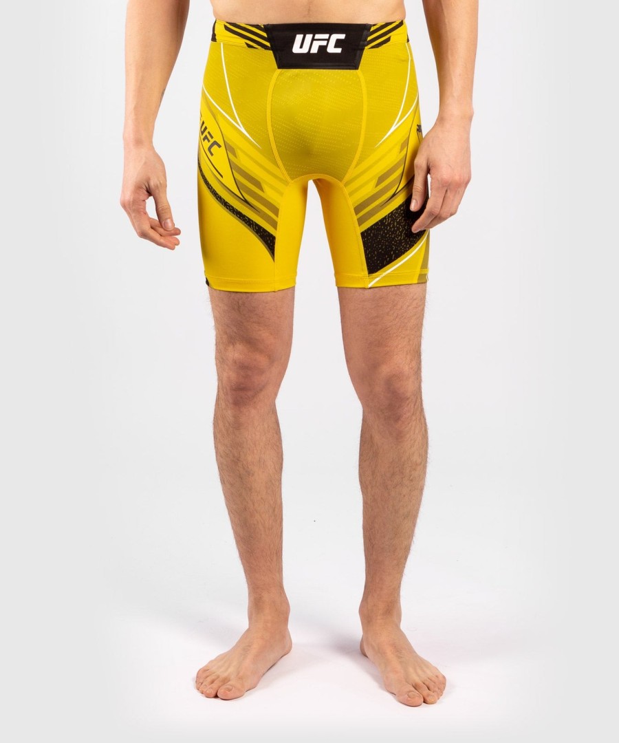 shorts ufc venum authentic fight night masculino vale tudo - corte curto - amarelo
