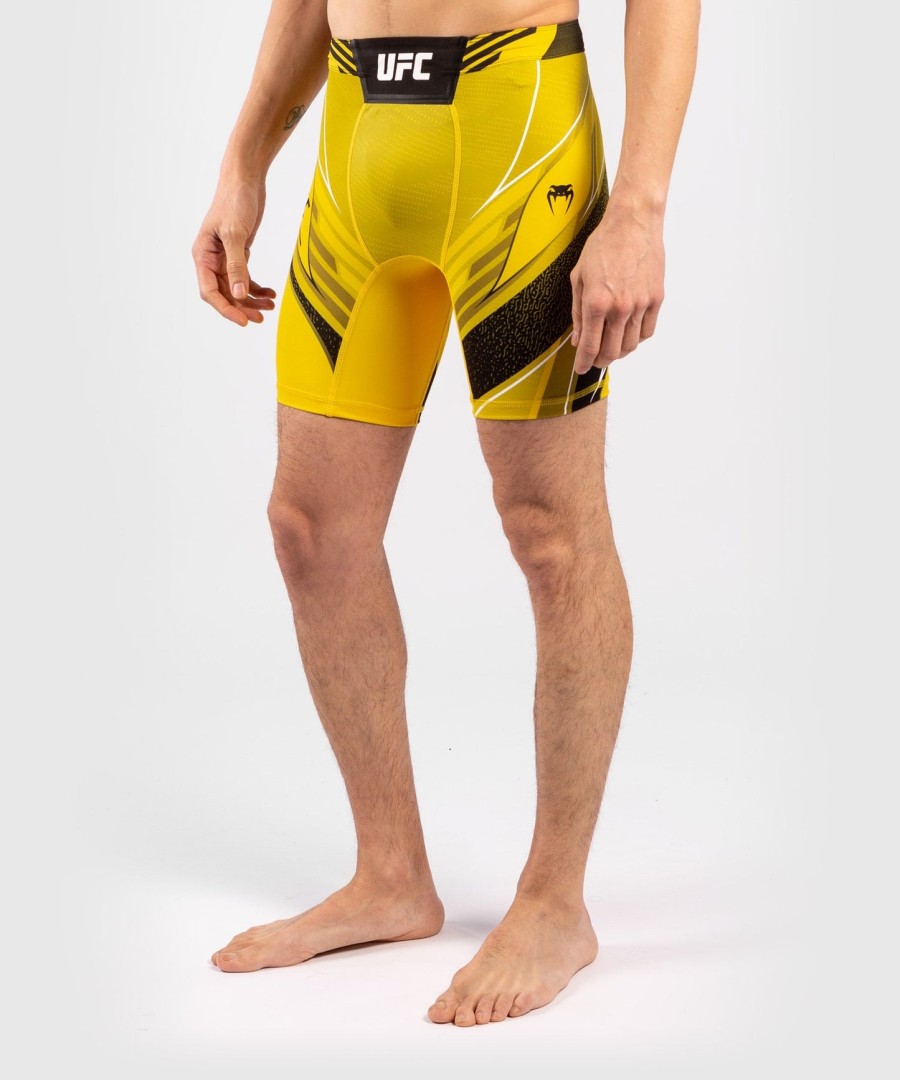 shorts ufc venum authentic fight night masculino vale tudo - corte curto - amarelo