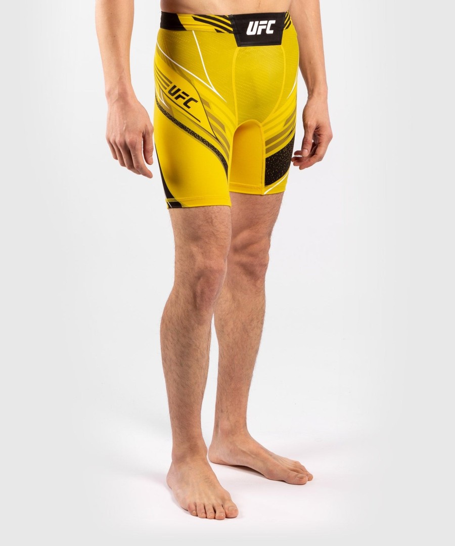 shorts ufc venum authentic fight night masculino vale tudo - corte curto - amarelo