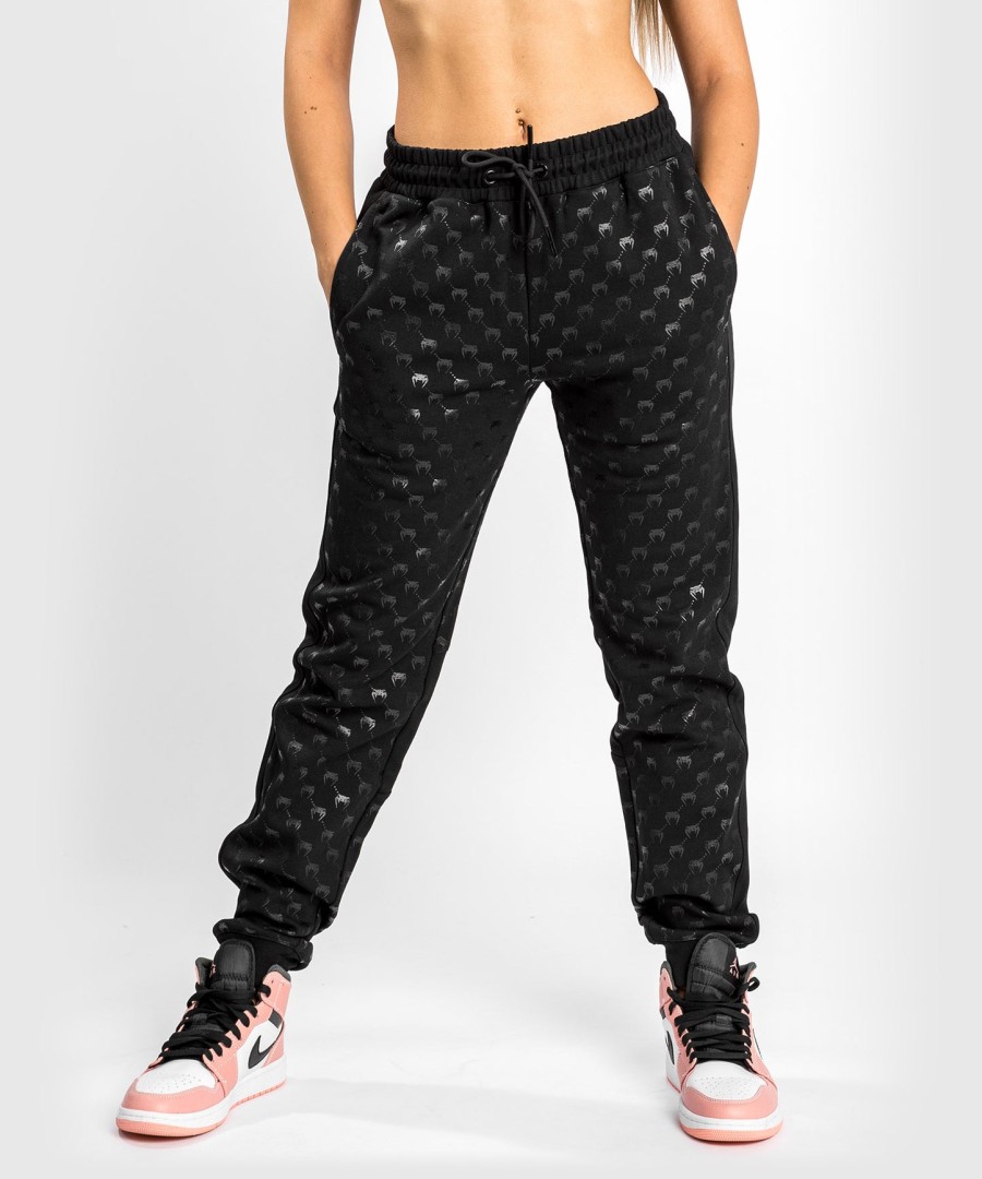 calça jogger venum monogram - feminina - pretorosa dourado