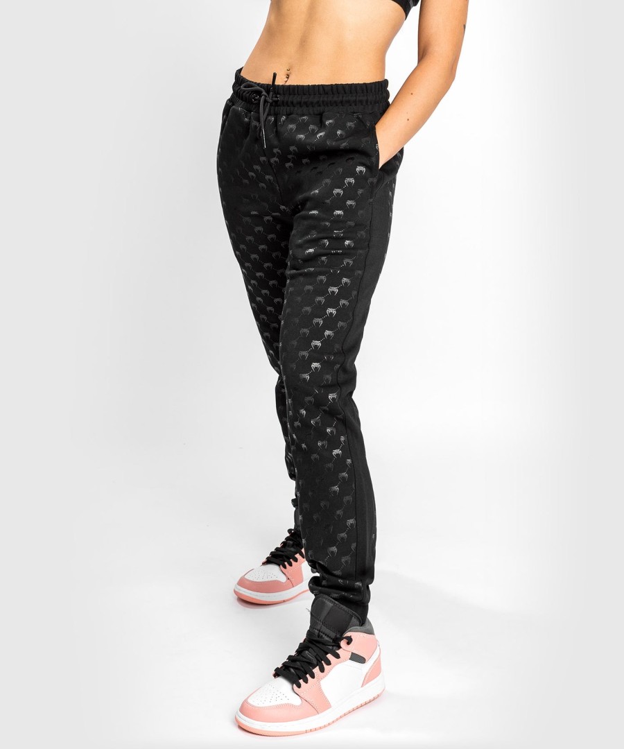 calça jogger venum monogram - feminina - pretorosa dourado
